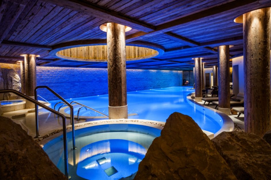 The vast indoor swimming pool with Jacuzzi baths at The Alpina