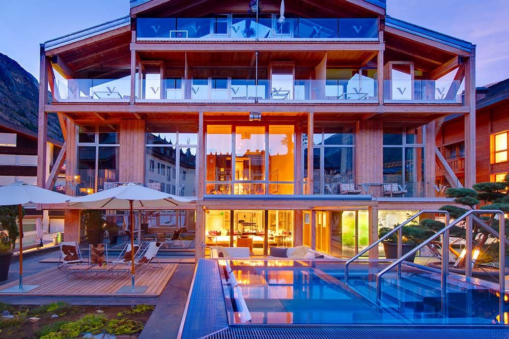 A view of the outdoor hot tub and back of The Backstage Hotel, a luxury hotel in Zermatt designed by the famous Zermatt architect, Heinz Julen.