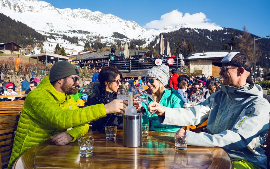 People enjoying a few drinks whilst on their luxury ski holiday in Verbier.