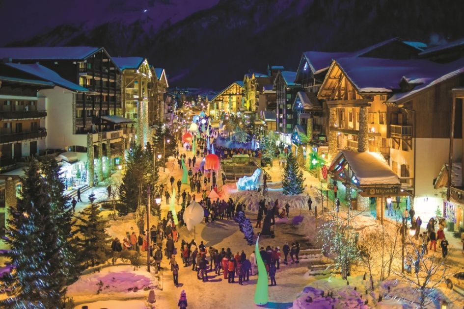 A nighttime scene of the picturesque streets in Val d'Isere, showcasing how it is one of the best ski hresorts in the Alps