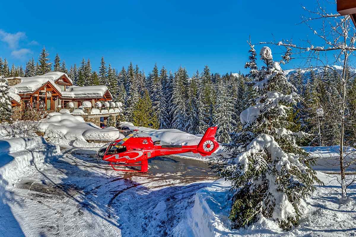 Exterior image of Belmont Estate, showcasing the helipad and forest surroundings.