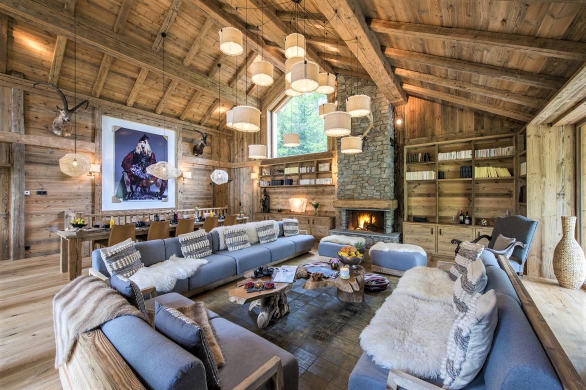 Chalet Inoko, Val d'Isere The cosy living area, covered with smooth alpine wood and lifted by the stone fireplace.