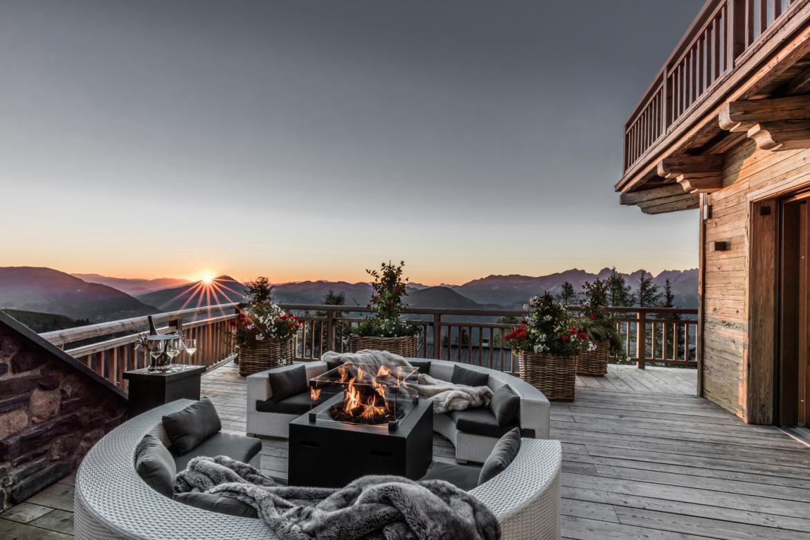 Hahnenkam Lodge, Kitzbuhel Balcony shot hosting outdoor lounge area and panoramic views of Kitzbuhel.