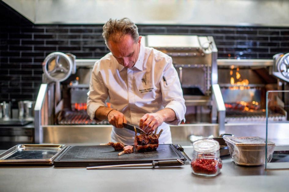 Le Schweizerhof Kitchen. Credit: Le Schweizerhof Kitchen Chef at Le Schweizerhof Kitchen preparing a gourmet meal for the ultimate lunch in Zermatt