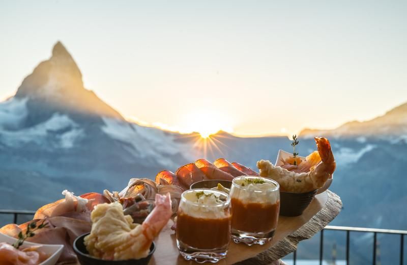 Canapés and gourmet dining with Matterhorn views during a self catered ski holiday in Zermatt