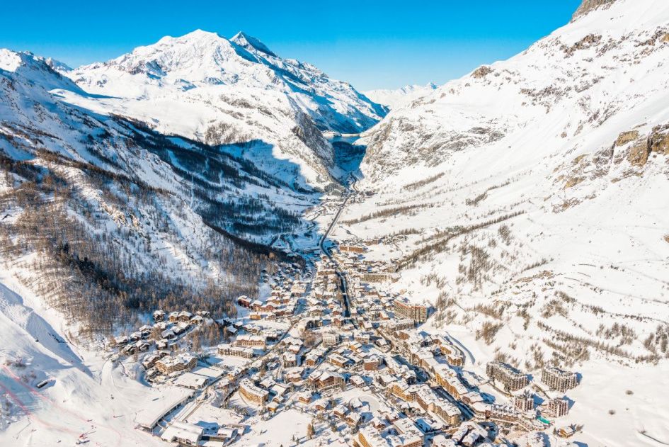 A drone shot of one of the best resorts in the French Alps, Val d'Isere. Showing mountains and village