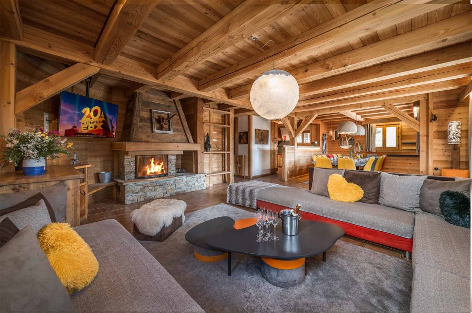 The living area of Chalet Le Chateau, one of a cluster of five ski in ski out contactless catered chalets in Alpe d'Huez.