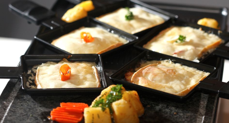 Raclette. Credits: Wasanti. An example of raclette, as enjoyed on the raclette night of our contactless catered ski holiday.