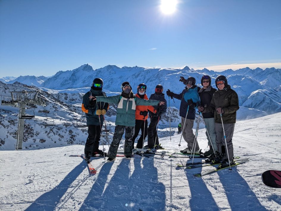 Skiing on a sunny day in Alpe d'Huez. Skiing in Alpe d'Huez on a contactless catered ski holiday.