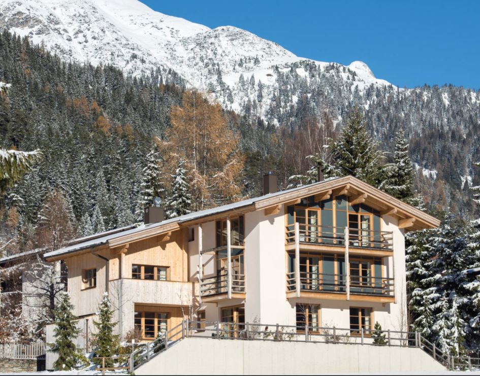 A sunny exterior of the luxurious Chalet Griffin, with south-facing balconies ideal for the longer days of a spring ski holiday in St Anton.