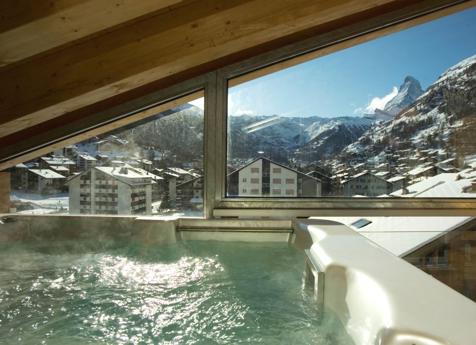 Zermatt Lodge The indoor hot tub and Matterhorn views from the luxury penthouse apartment of Zermatt Lodge.