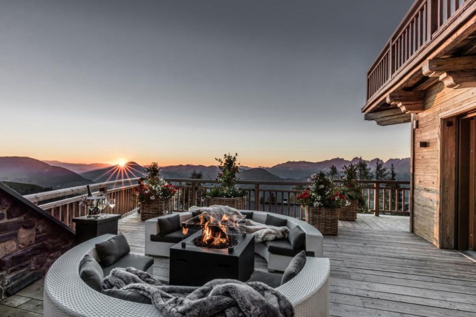 The view of the sun setting from the Hahnenkamm Lodge Terrace, in Kitzbuhl, will transport you to the mountains instantly.