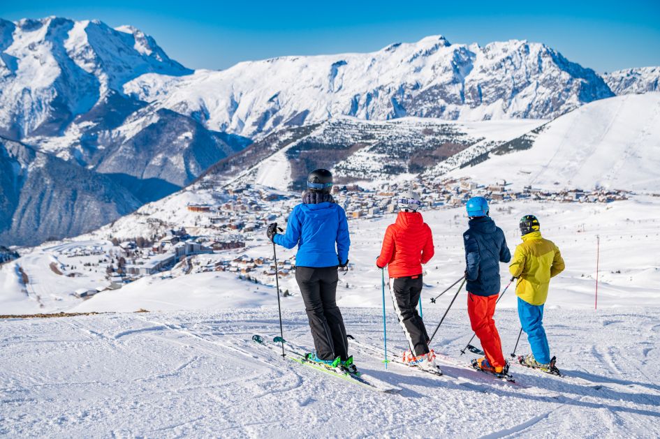 Alpe d'Huez. Copyright: Lionel Royet/Alpe d'Huez Toursime. Looking down on one of the best ski resorts for beginners, sunny Alpe d'Huez.