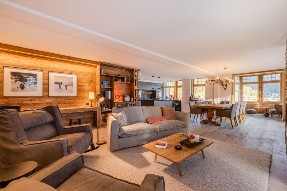 The open-plan living area of the Apartment Mountain Dream in Davos, home to Europe's first decelerated ski area, a perfect ski resort for beginners. 