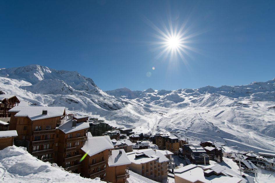 A sunny shot of Europe's highest ski resort, Val Thorens, expertly suited for early season skiing.