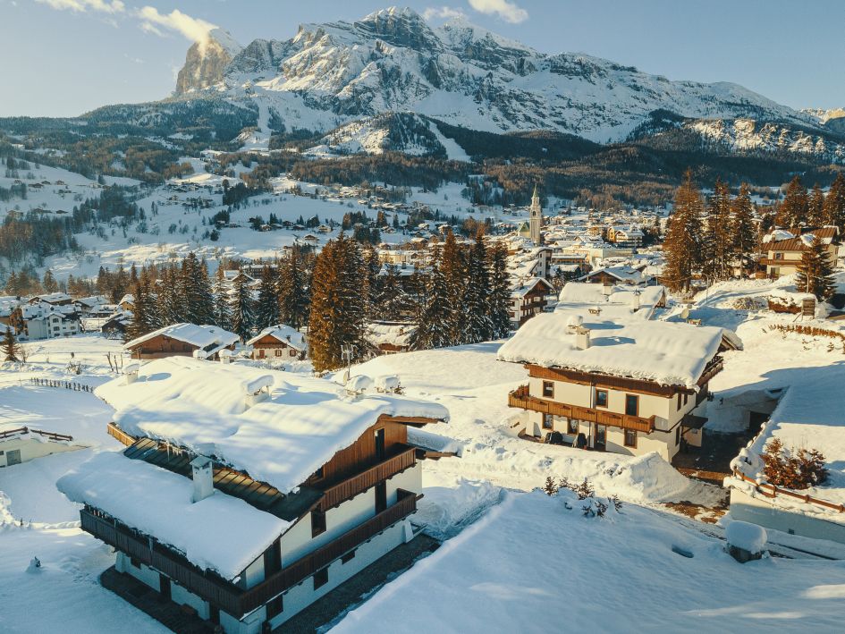 A pair of luxury catered chalets in Cortina on the LV Estate, LV|01 Dolce Vita & LV|02 Perla, overlooking Cortina and the Tofana ski area beyond.