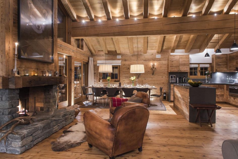 Chalet Treize Etoiles is a beautiful penthouse-apartment in Verbier sleeping up to 12 guests. Its open alpine living areas are perfect for all the family, with traditional touches throughout, such as the exposed stone fireplace on the left and exposed wooden beams on the ceiling.