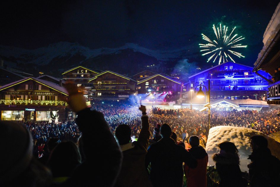 New Year ski celebrations in Verbier with lots of people gathered in Place Centrale to watch the fireworks.