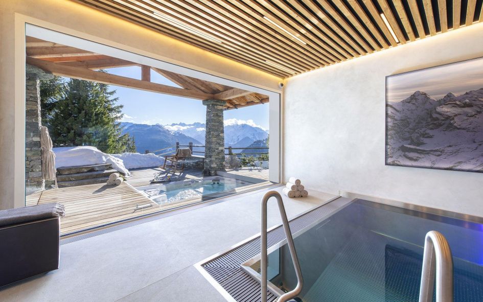 Luxury chalet in Verbier with a luxurious indoor swimming pool, outdoor hot tub and other spa facilities.