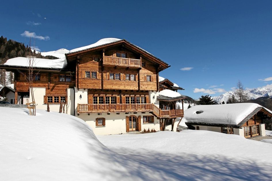 Pictured is Tivoli Lodge, a luxury ski in chalet in Switzerland. Taken of the exterior in the snow and sun. A beautiful luxury catered ski chalet.