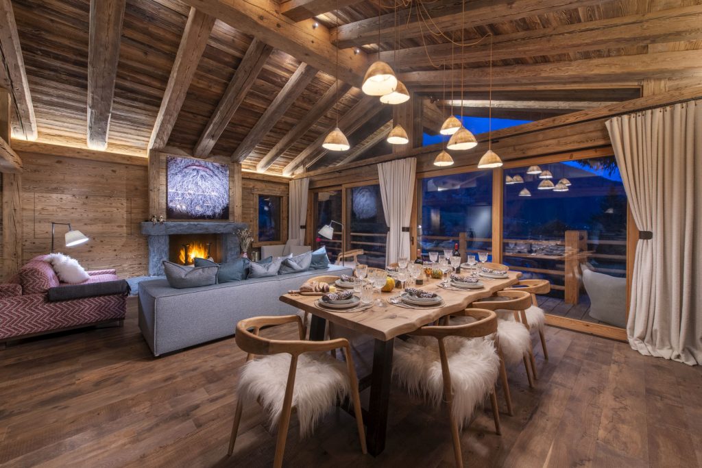 The open-plan dining and living area of Chalet Grand Coeur, a luxury catered ski chalet in Verbier.