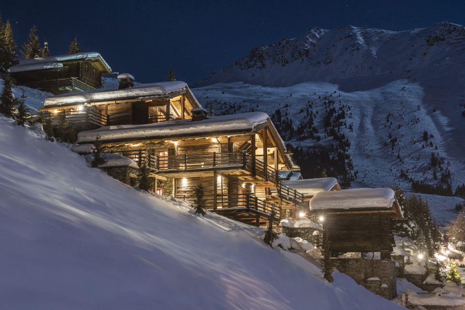 Luxury seasonal chalet with stunning mountain views and outdoor hot tub.