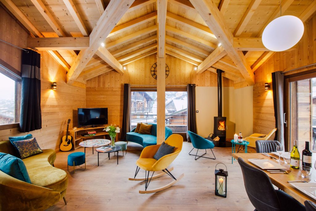 Alpine wooden iving room with stylish furnishings in Chalet Melodie, a sustainable ski chalet in Morzine perfect for eco-conscious winter travel and holidays.