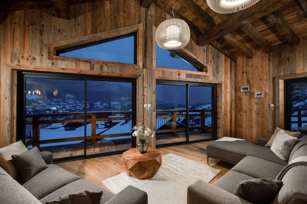 Living room with a view in Chalet Alpaga 1, one of the sustainable ski chalets in Morzine.