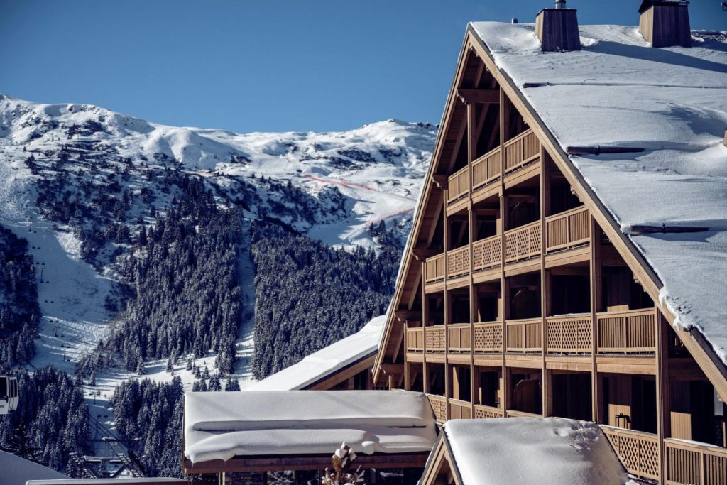 Antarès Residence in Meribel, with ski slopes in the background.