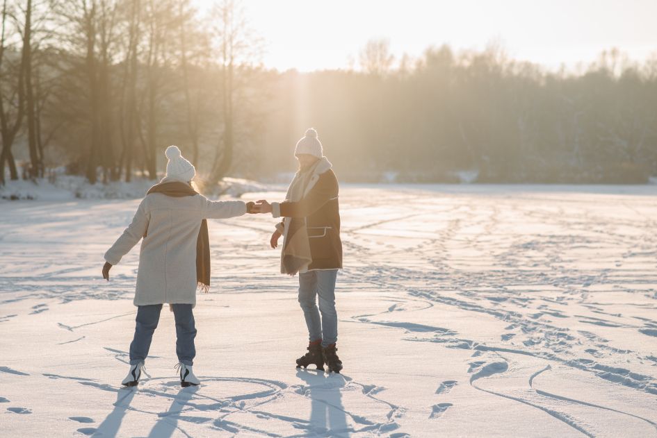 Couple in the snow with ice skates