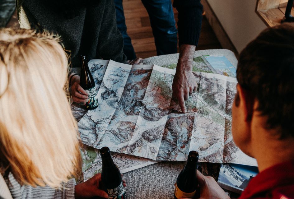 Map Reading in Chalet Couttet. Credit: Chalet Couttet Chamonix