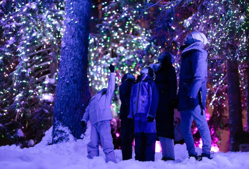Lantern Path in Crans Montana. Credit: Maxime Aliaga via Crans-Montana Tourism Children and parents illuminated by purple light in the sparkling forested lantern path in Crans Montana, a great family-friendly activity for the Christmas season in the Swiss Alps.