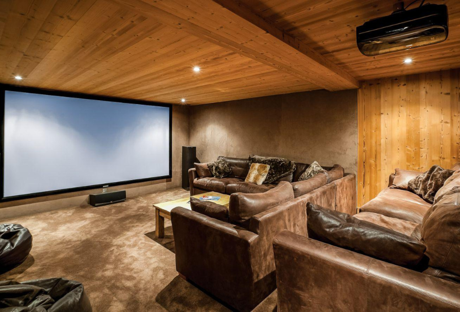 Chalet Amazonia, Chamonix Large theatre room with plenty of comfortable seats, carpet flooring and a wood finished interior, perfect for family movie nights.