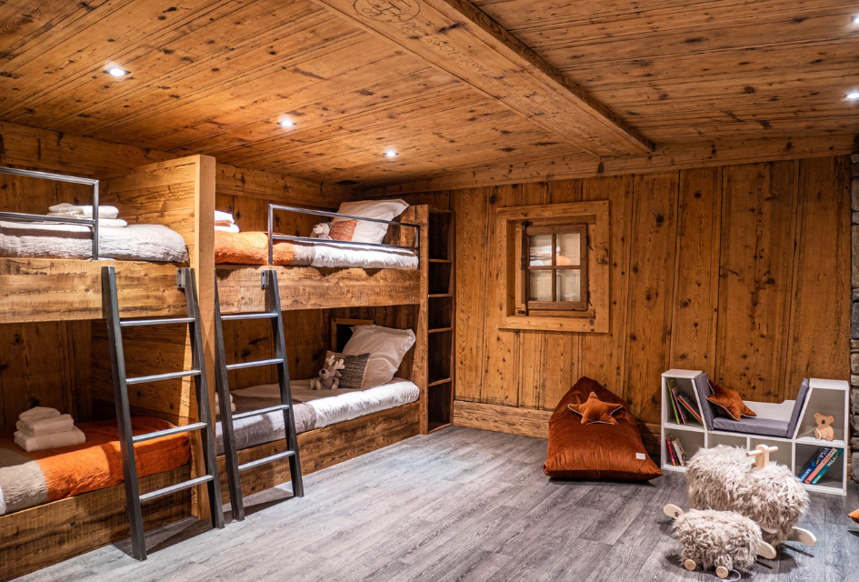 Chalet Bonami, Chamonix Children's bunkroom with 4 bespoke bunk beds and a play corner. Kinds will love this room as one of their dens on a luxury family holiday in Chamonix staying at Chalet Bonami.