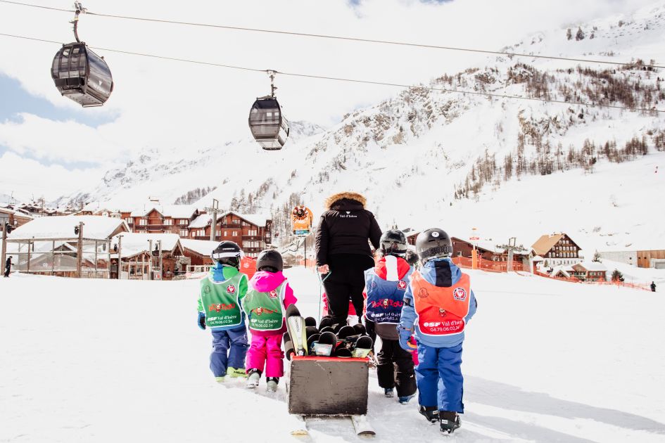 Credit: Anna Cantu via Val d'Isère Tourism A group of kids in Val d'Isère enjoying a ski lesson and playing in the snow.