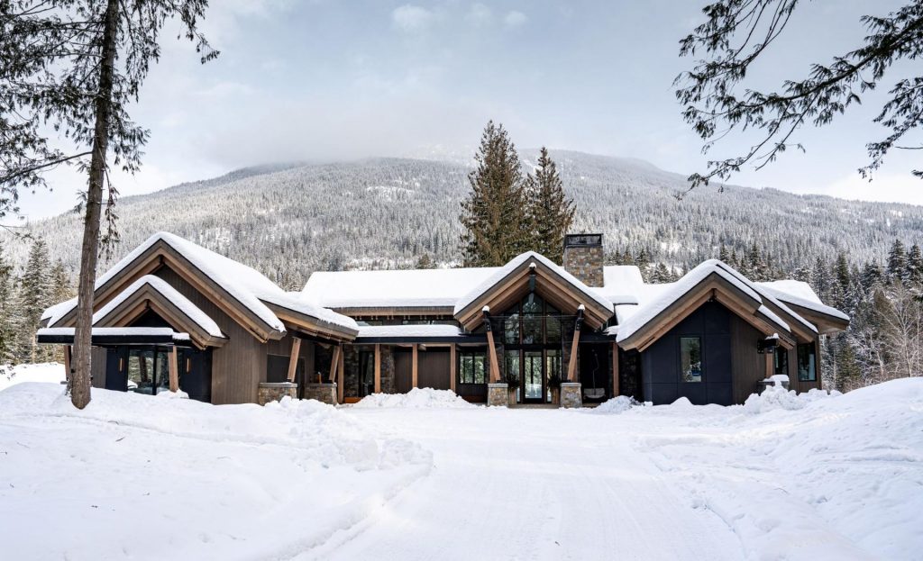 Exterior of mountain Lake Chalet in the snow.
