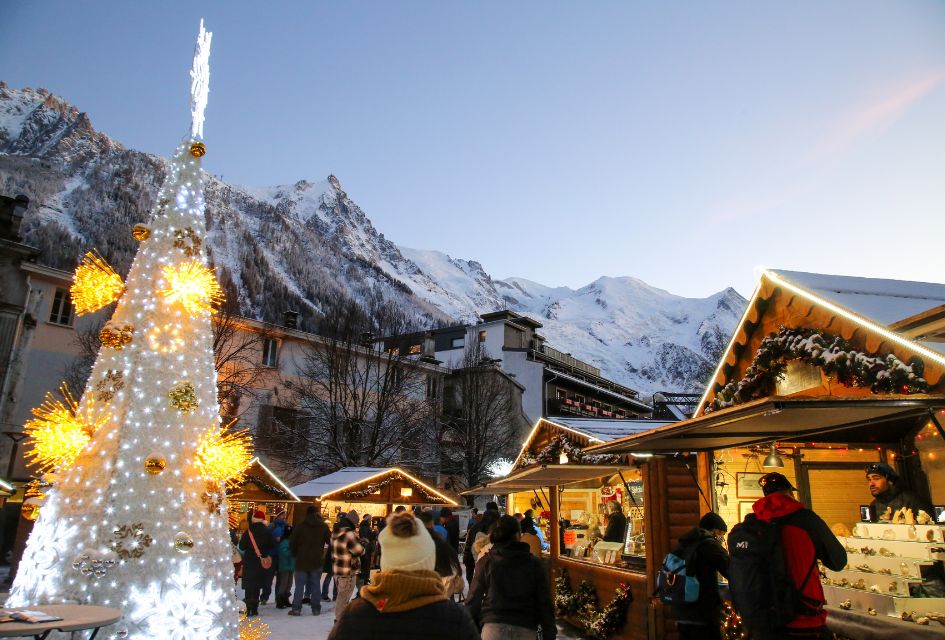 Chamonix Town with Christmas Markets and Festive Lights: Alexandre Juillet Christmas markets in Chamonix centre below Chamonix peaks and dusk skies
