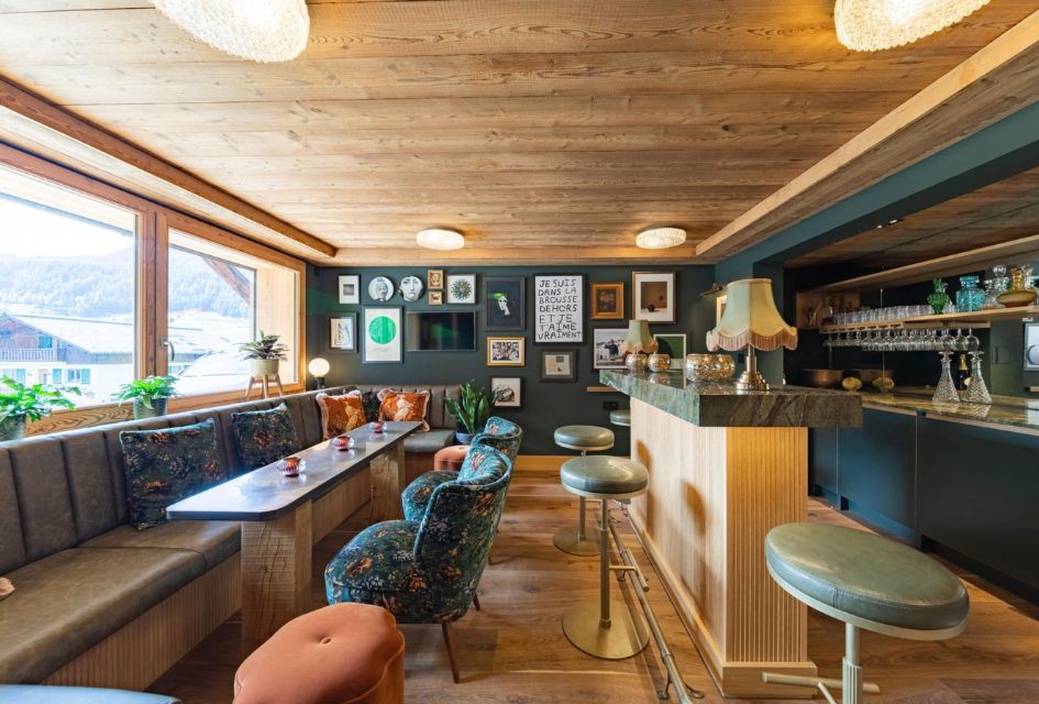 Chalet Doyen, Morzine A cosy home bar with a boutique decor and plenty of seats for guests.