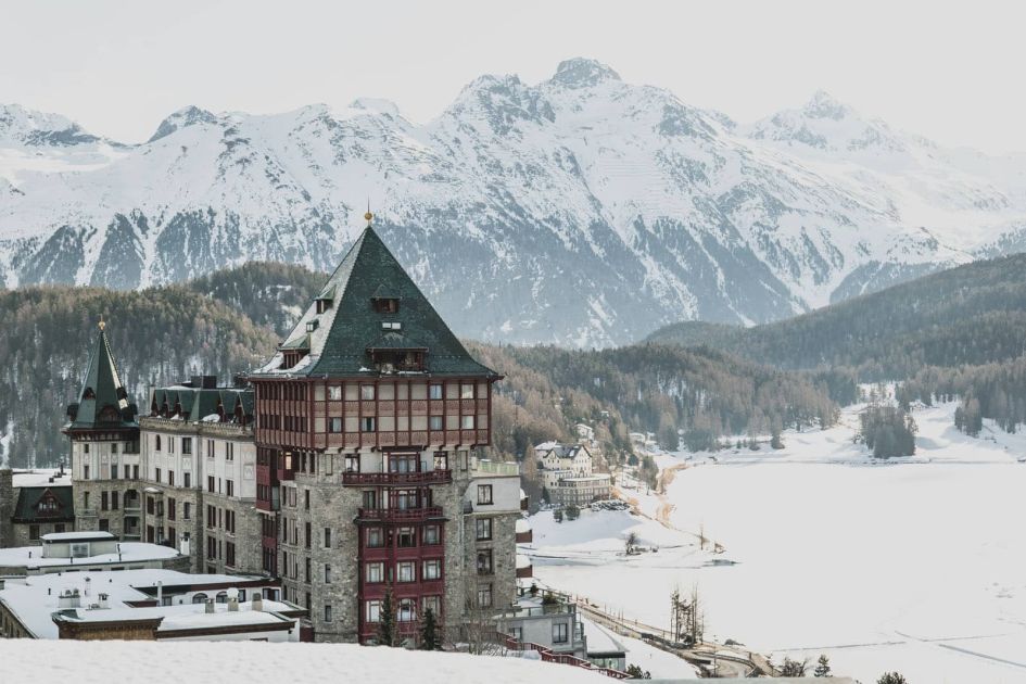 Header image for the Best Luxury Ski Hotels in Europe blog, showcasing the iconic Badrutt's Palace in St Moritz, with the frozen Lake St Moritz and snow-covered mountains in the background.