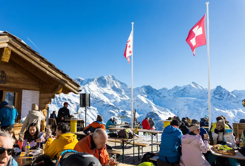 Dining slopeside in Grimentz. Credit: Sierre-Anniviers Marketing. Image of a slopeside restaurant/bar in the Grimentz-Zinal ski area.