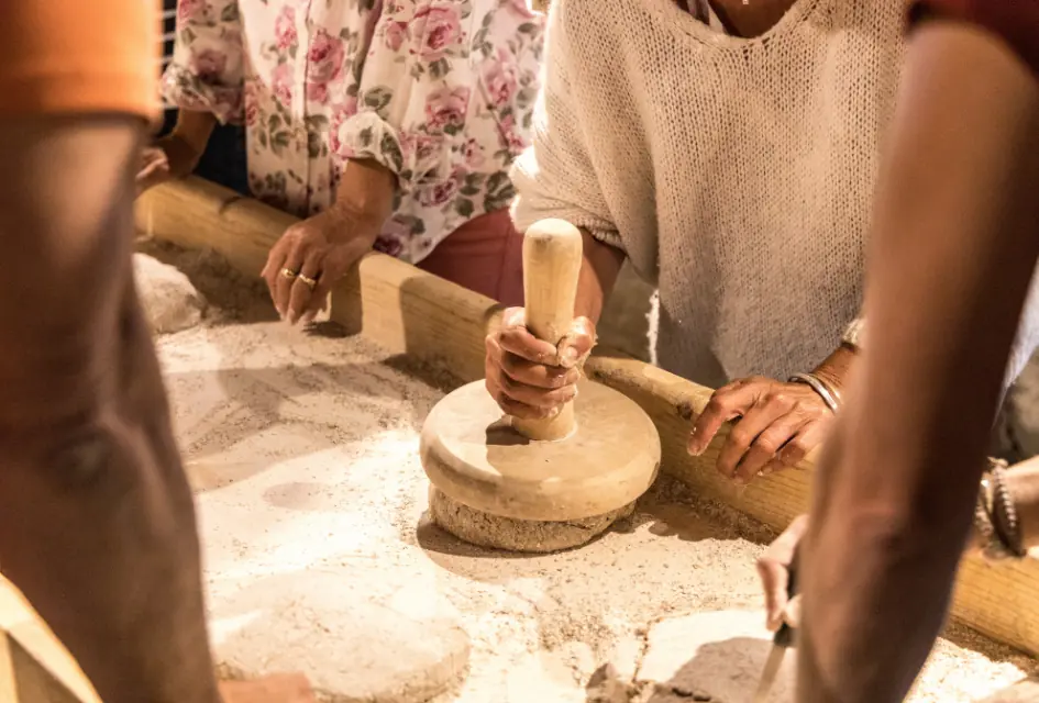 Rye bread making in Grimentz. Credit: Sierre-Anniviers Marketing. Rye bread making session shaping the rye bread before placing in the communal oven.