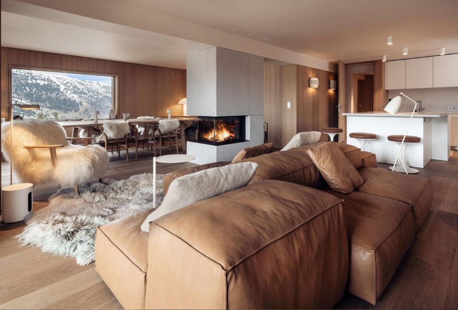 Antarès 10, Méribel Cosy open-plan living space, warm colours and plush furnishing surround a dual-aspect fireplace in Antarès 10.