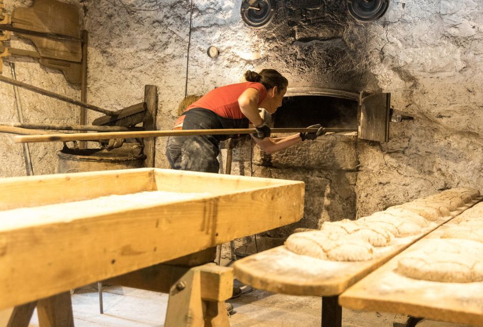 Baking Traditional Rye Bread in Grimentz in a communal oven.