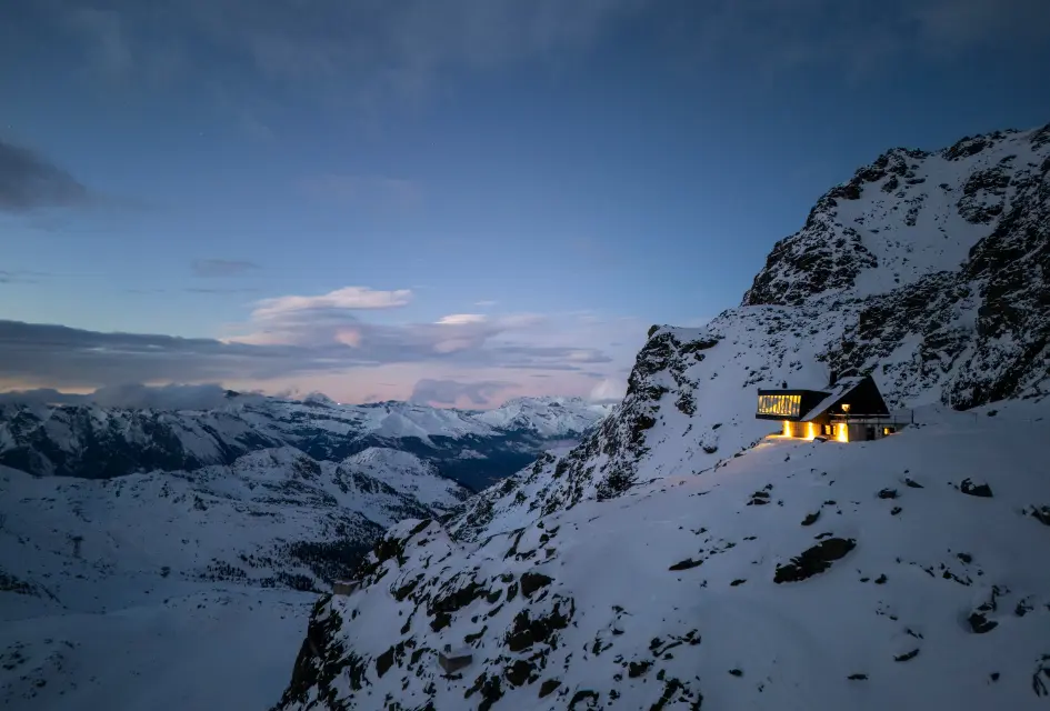 Cabane Tortin, Verbier Dusk view of Cabane Tortin from afar, lit up among the mountaintops.