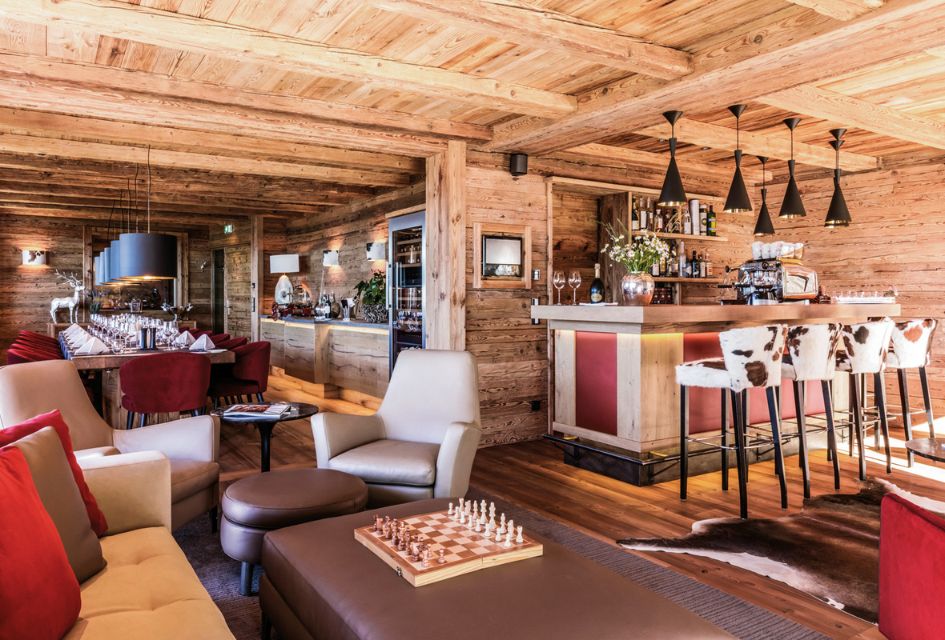 Living area and in-house bar in Hahnenkamm Lodge, Austria
