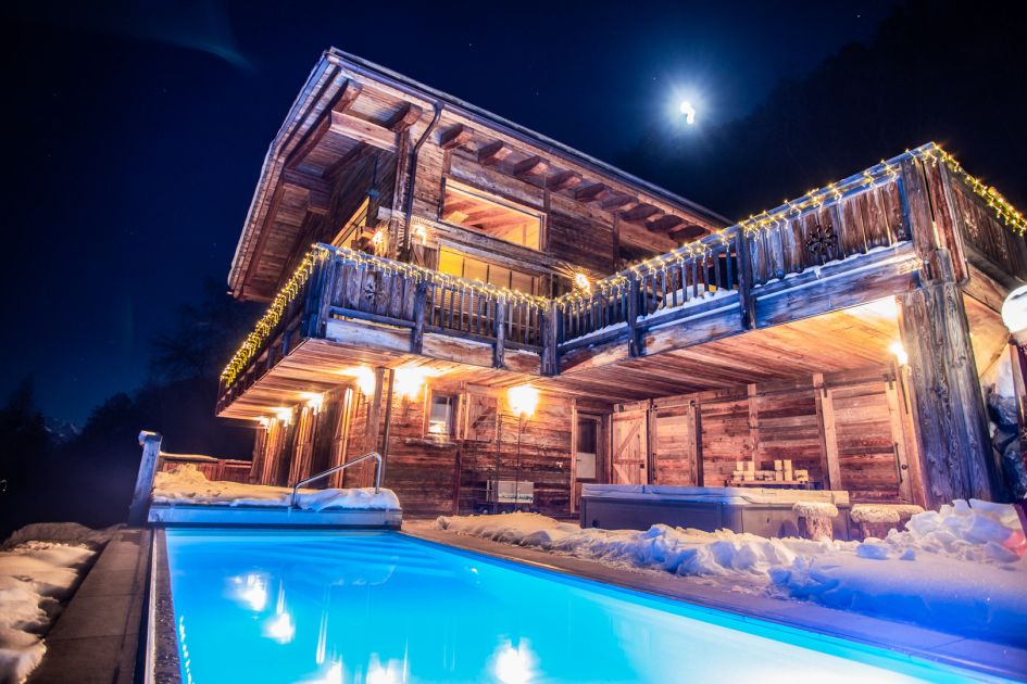 Chalet V, Verbier Luxury Chalet flaunting a heated outdoor pool under a beautiful nightsky