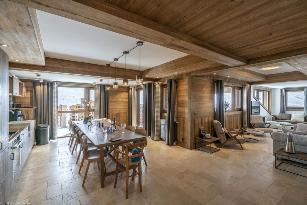 Cocoon 14, Val Thorens Alpine-luxe living and dining room adopting an open-plan design, with views of the slopes and valley.
