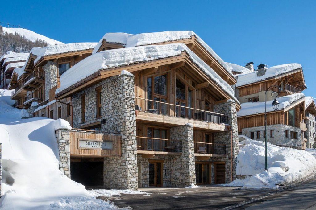 Silverstone Lodge 7, Val d'Isère An exterior of the Silverstone residence, built from noble wood and stone.